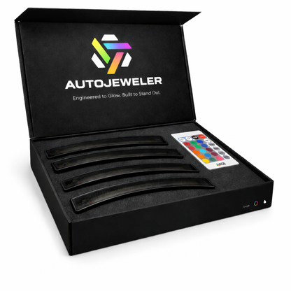 AutoJeweler RGB LED side marker light kit showing four smoked lens markers with foam insert packaging and handheld remote control