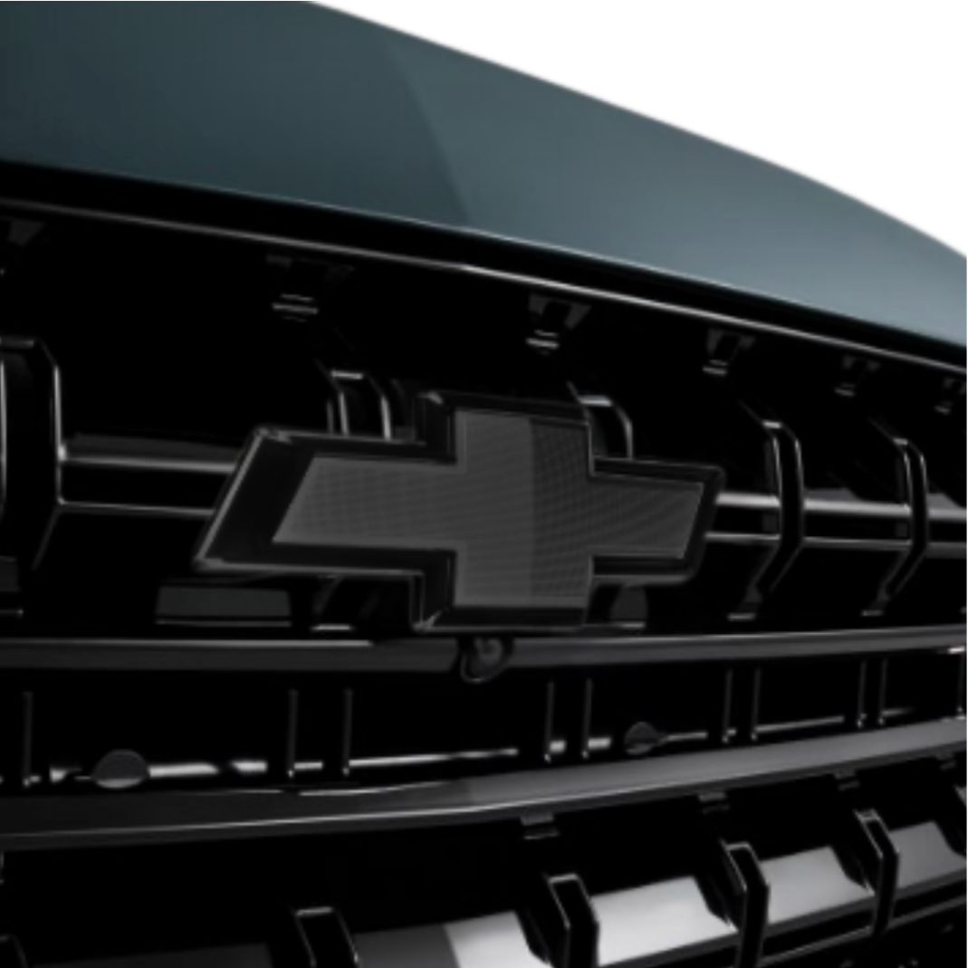 Close-up of black bowtie grille emblem showing OEM-style fitment on Silverado grille.