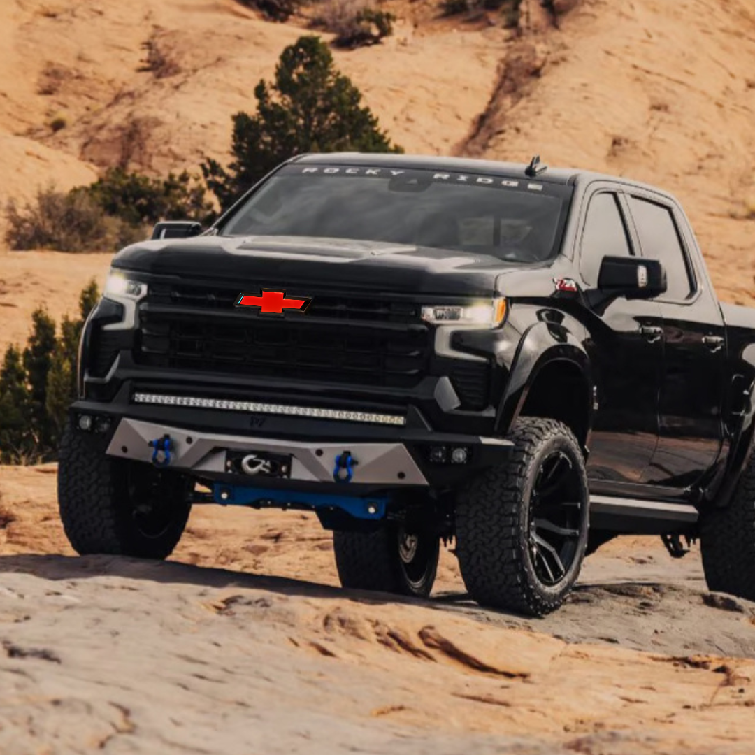 Off-road Silverado on rocky trail with red/black LED Bowtie emblem
