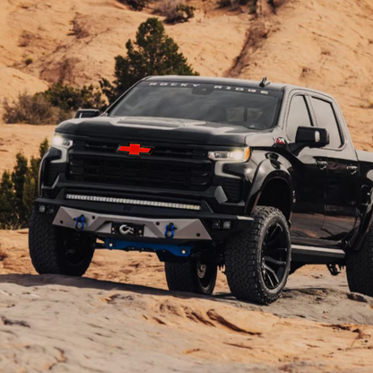 Off-road Silverado on rocky trail with red/black LED Bowtie emblem
