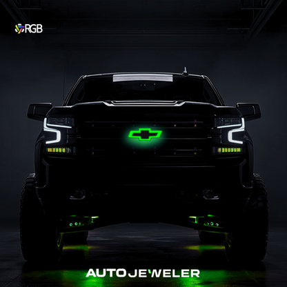 RGB LED grille bowtie glowing green on Chevy Silverado; night garage scene.