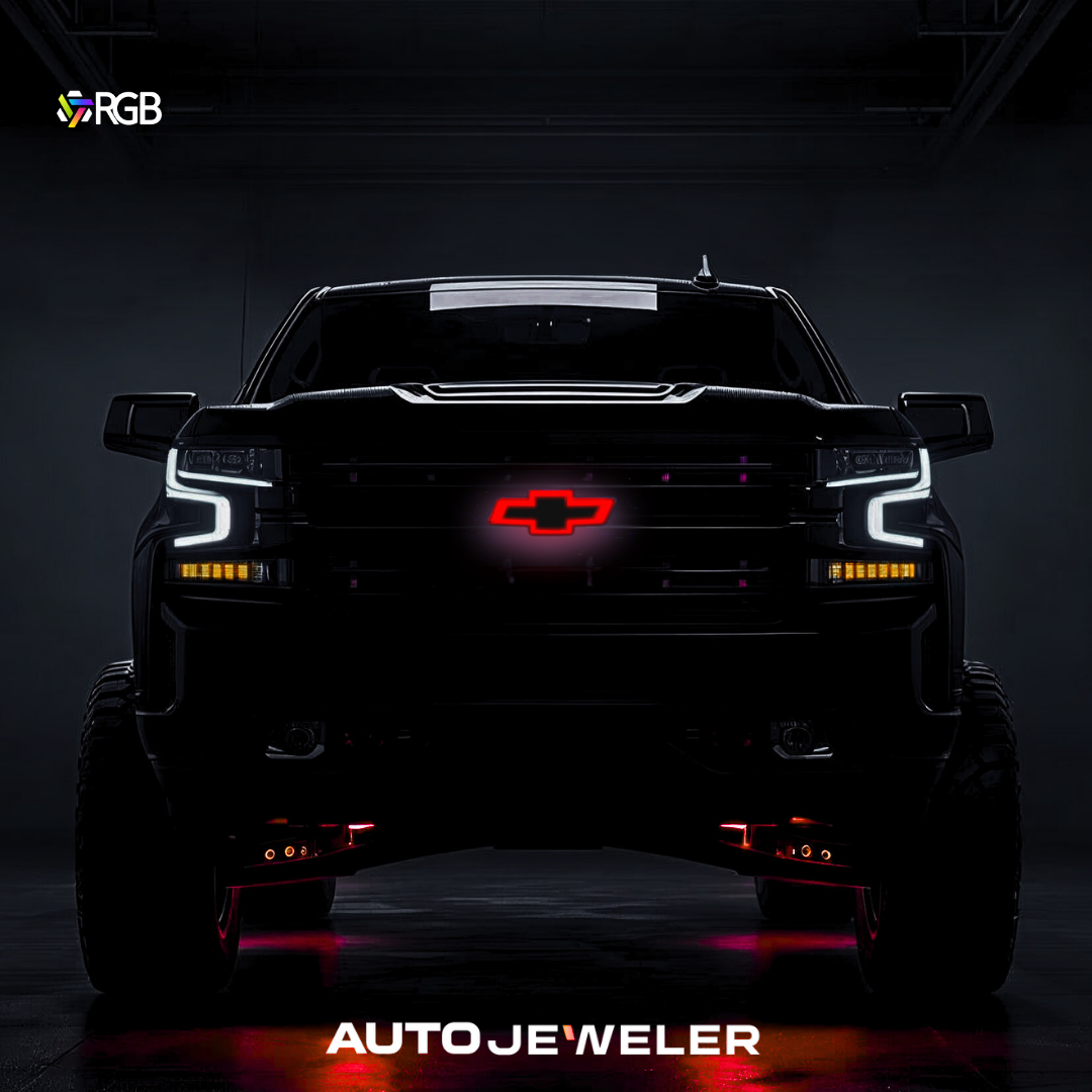 RGB LED grille bowtie glowing red on Chevy Silverado front; gloss black finish.