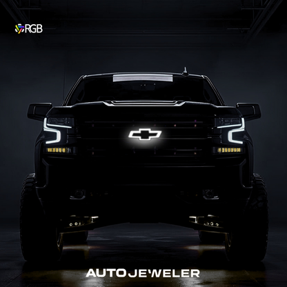 RGB LED grille bowtie glowing white on Chevy Silverado; chrome/black finish, front hero shot