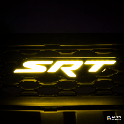 AutoJeweler RGB Flow Series SRT LED grille emblem glowing yellow installed in Dodge Charger grille
