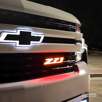 AutoJeweler Z71 LED grille emblem glowing red installed on Chevy truck for aggressive nighttime appearance