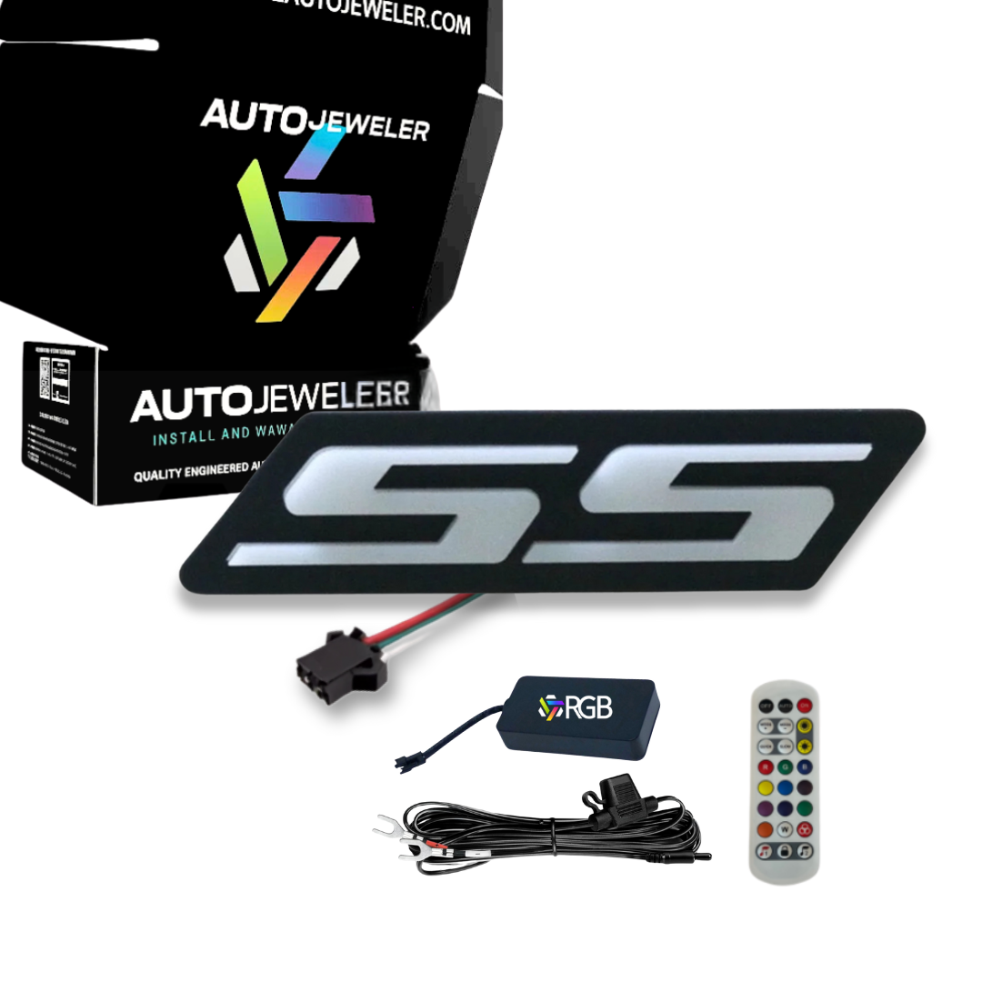 Chevy Camaro SS RGB Flow Series LED grille emblem kit including illuminated SS badge, wiring harness, RGB controller, handheld remote, and AutoJeweler packaging