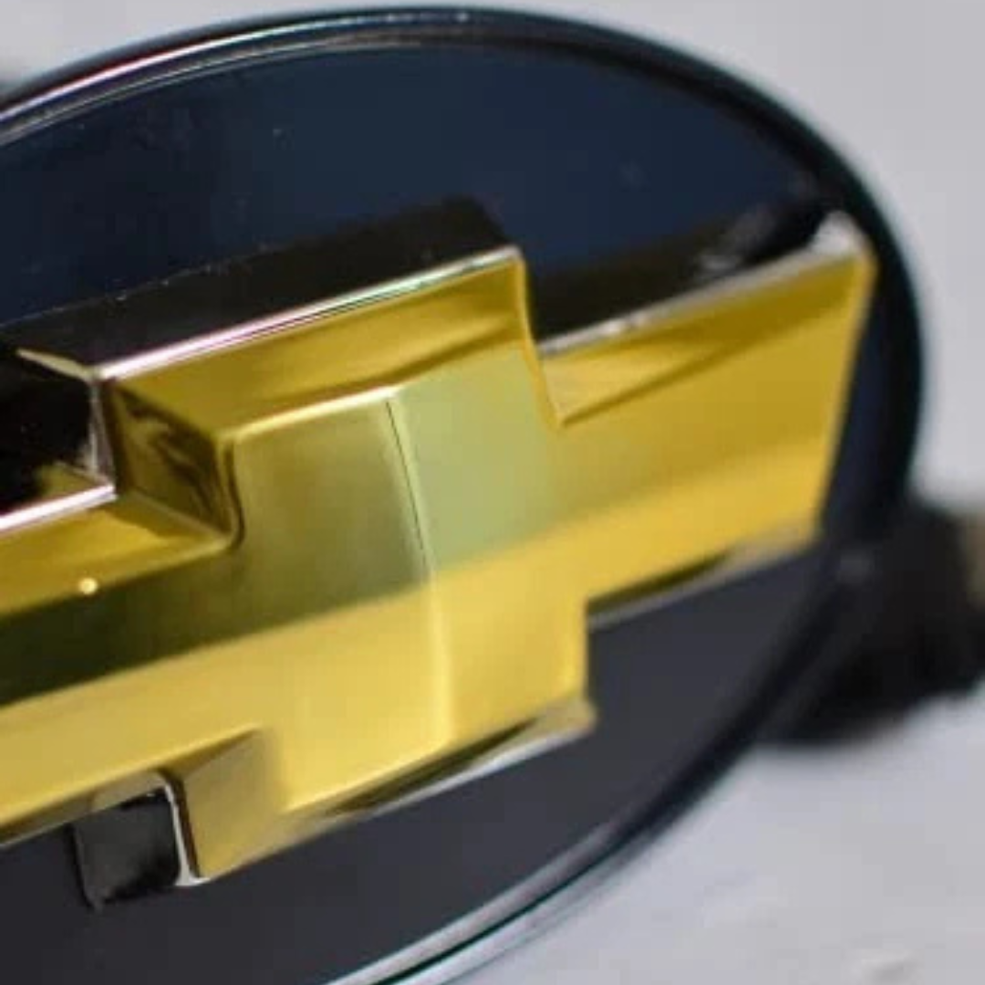 Close-up of chrome Chevrolet bowtie LED hitch receiver cover emblem detail