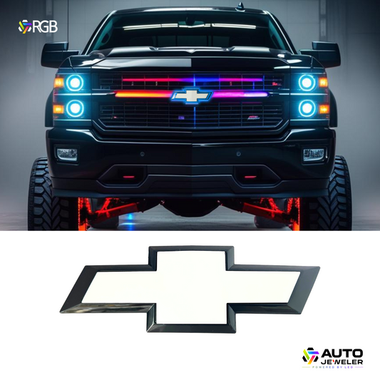 Front view of a lifted Chevy Silverado truck with AutoJeweler RGB LED Bowtie Grille Emblem illuminated in blue.