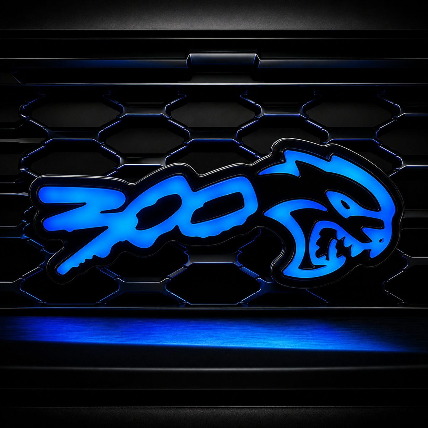300 Hellcat V2 Style Flow Series LED grille emblem glowing blue on a black mesh grille for Chrysler 300 custom builds.
