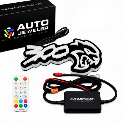 300 Hellcat V2 Style RGB Flow Series LED grille emblem package contents with AutoJeweler box, hybrid controller, wiring harness, and handheld remote.