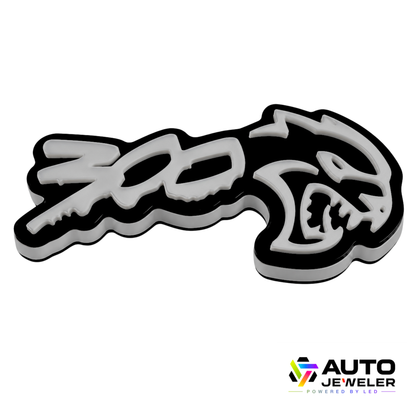 300 Hellcat V2 Style RGB Flow Series LED grille emblem for Chrysler 300 shown on a white background with black acrylic base and raised white design.