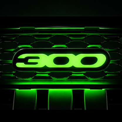 Chrysler 300 illuminated grille emblem glowing bright green with high-output LEDs, gloss black acrylic faceplate, and custom luxury sedan grille installation.