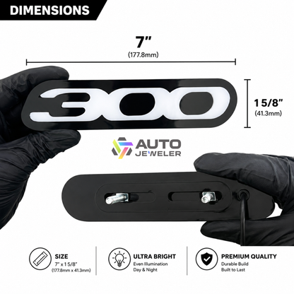 Chrysler 300 LED grille emblem dimensions guide showing overall size, mounting bracket design, gloss black acrylic construction, and installation hardware measurements.