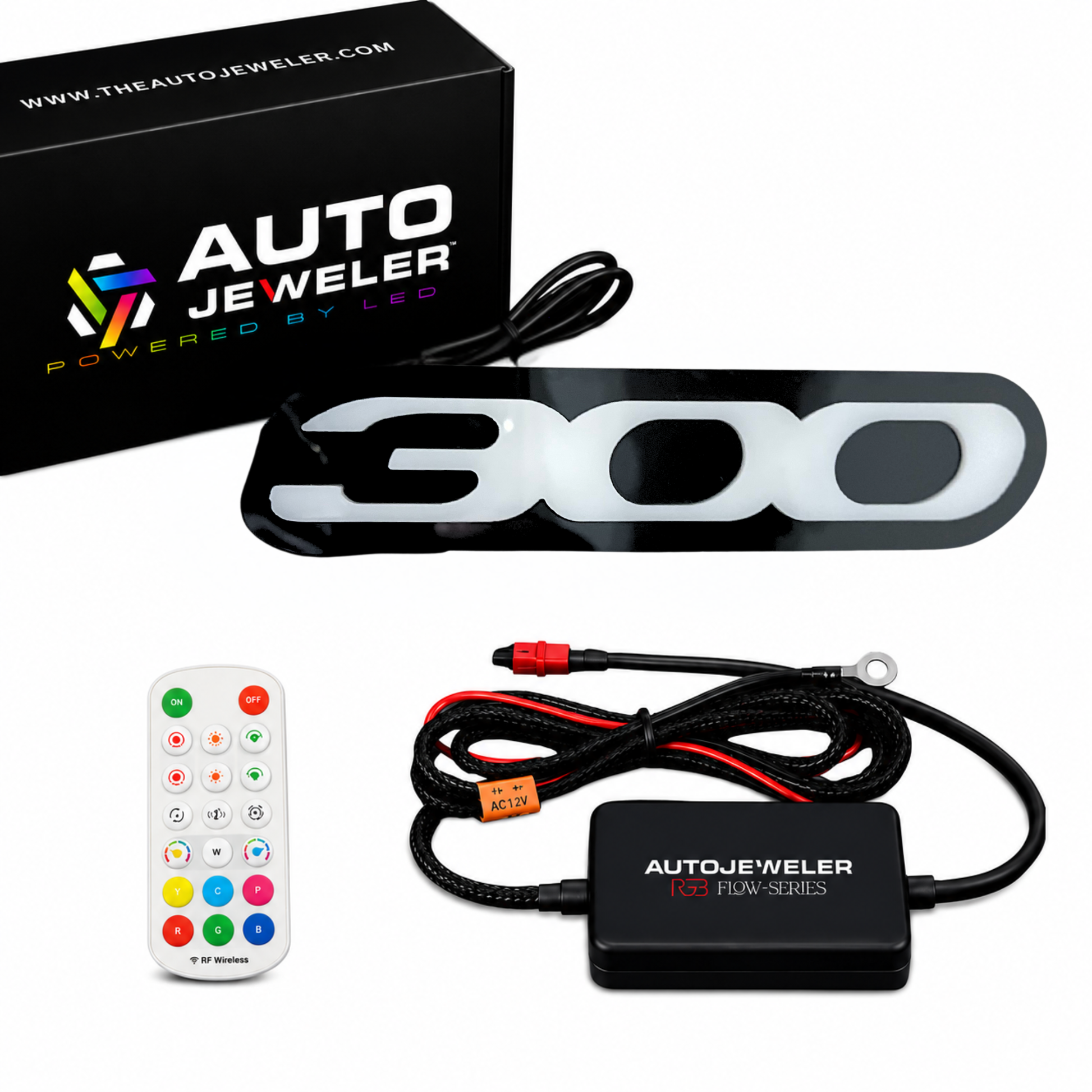 Complete Chrysler 300 RGB Flow Series LED grille emblem kit including illuminated 300 badge, AutoJeweler controller, RF remote control, wiring harness, and branded packaging.