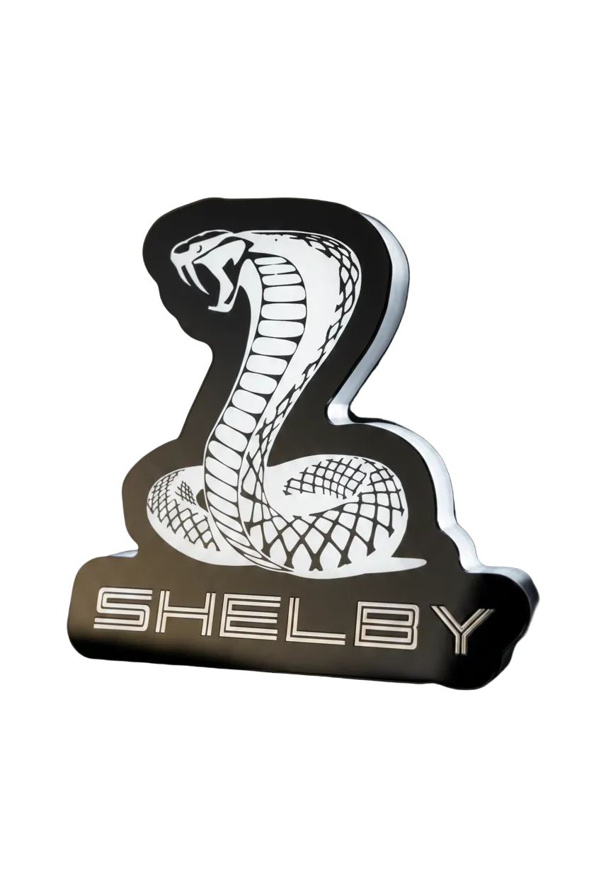 Custom Shelby Cobra RGB Flow Series LED grille emblem with black finish, cobra design, and SHELBY lettering.