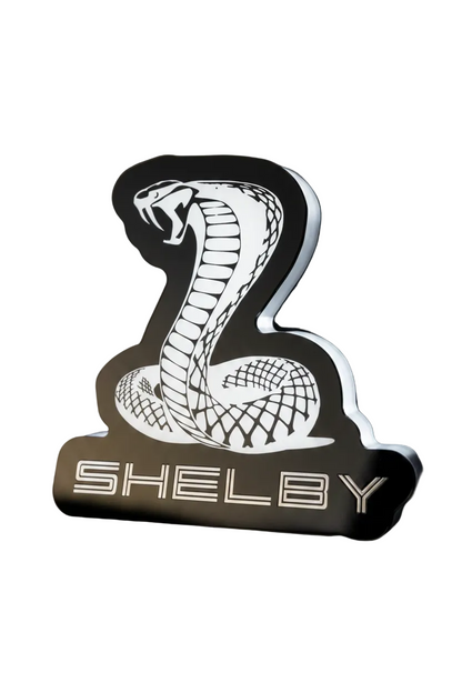 Custom Shelby Cobra RGB Flow Series LED grille emblem with black finish, cobra design, and SHELBY lettering.