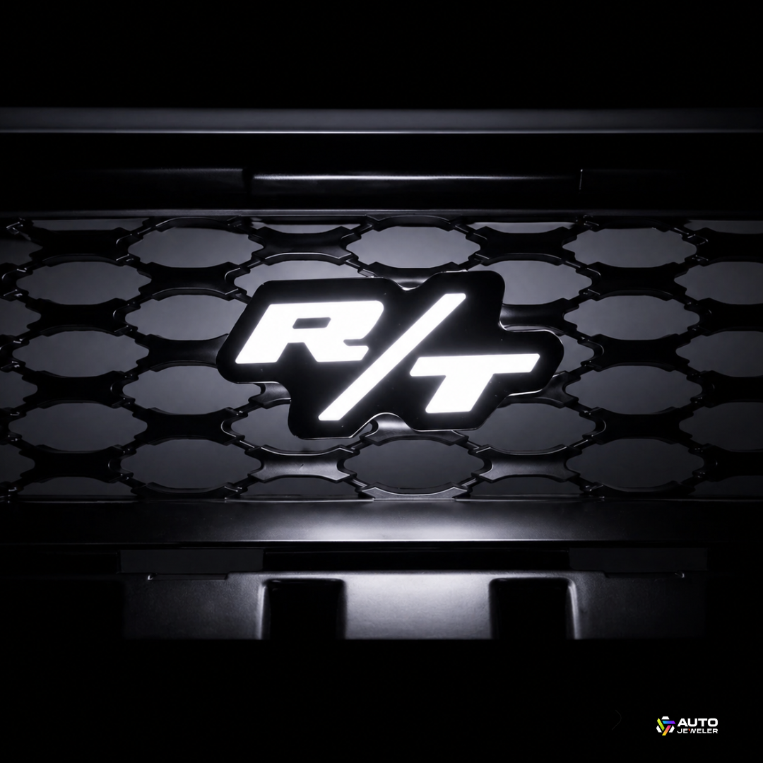 Illuminated Dodge R/T LED grille emblem in white lighting mounted on honeycomb grille, AutoJeweler Flow Series custom automotive lighting upgrade