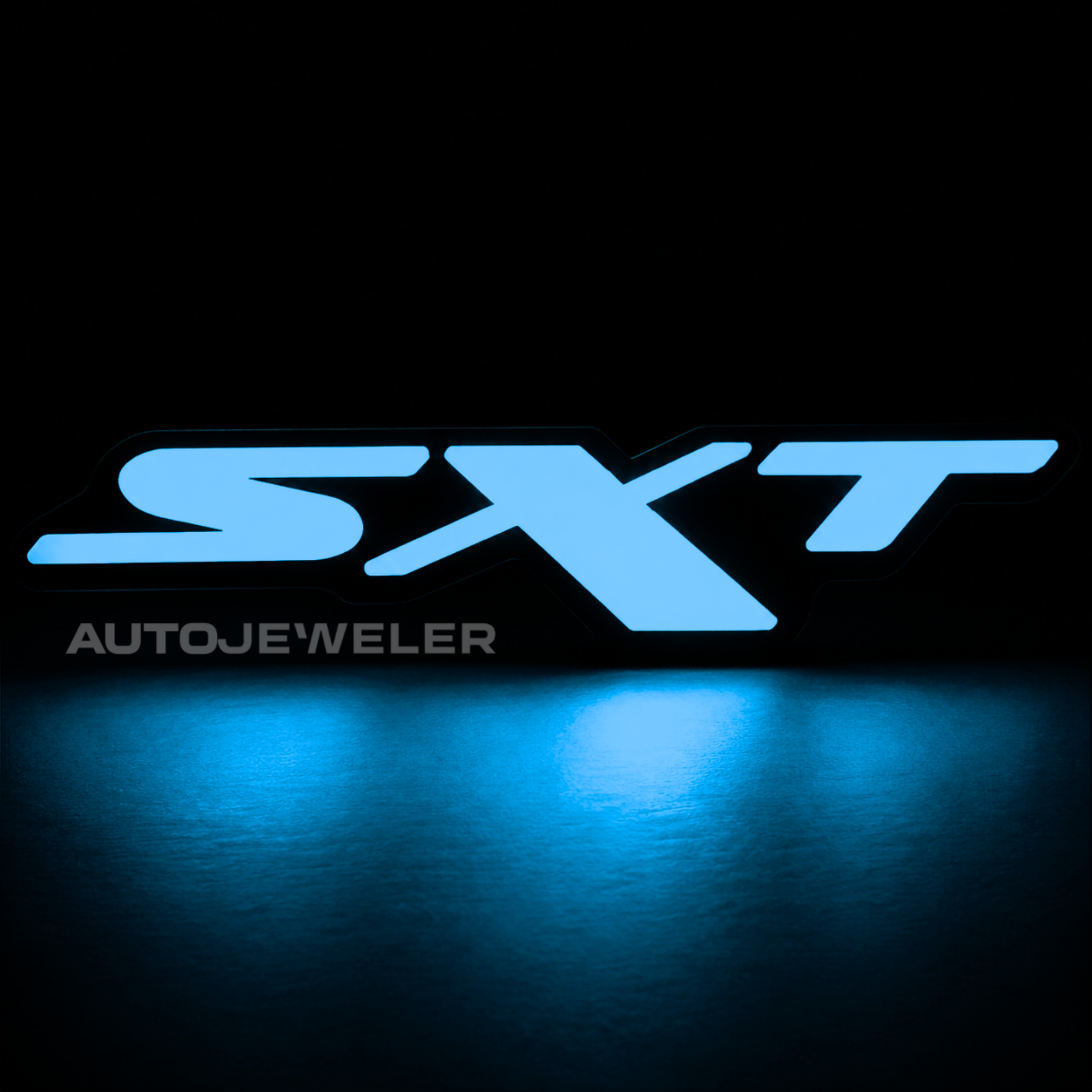 Dodge SXT RGB Flow Series LED grille emblem illuminated solid blue on a black background.