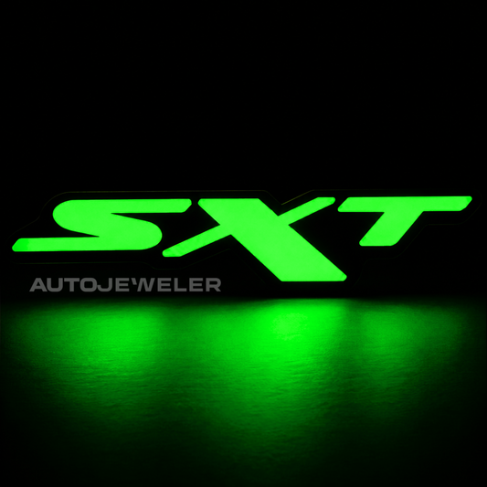 Dodge SXT RGB Flow Series LED grille emblem illuminated solid green on a black background