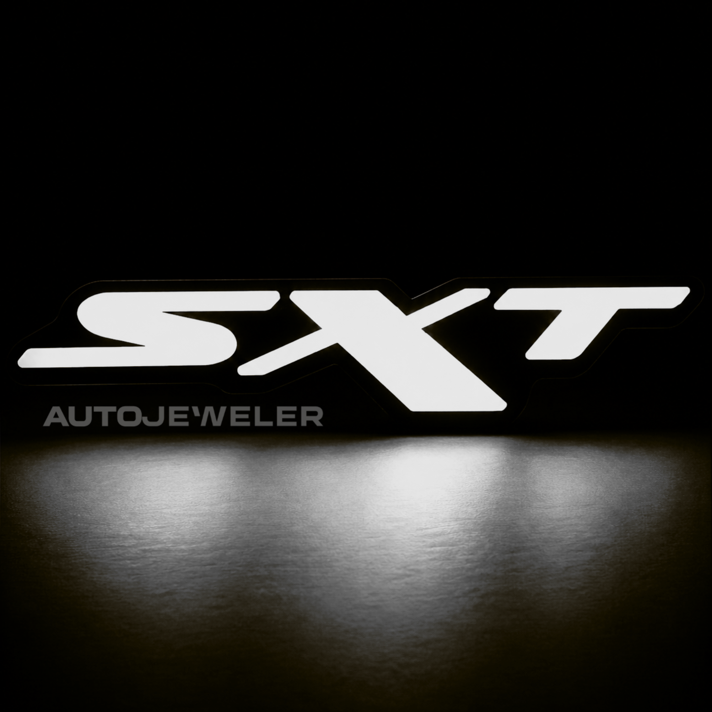 Dodge SXT RGB Flow Series LED grille emblem illuminated solid white on a black background.