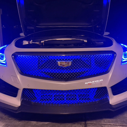 Flow Series RGB grille lighting installed on Cadillac grille displaying solid blue lighting