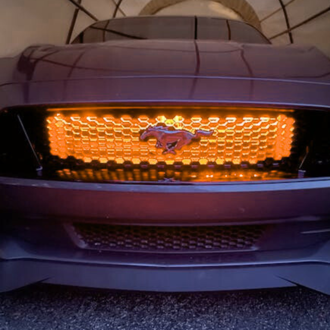 Flow Series RGB grille lighting installed on Ford Mustang with amber lighting effect