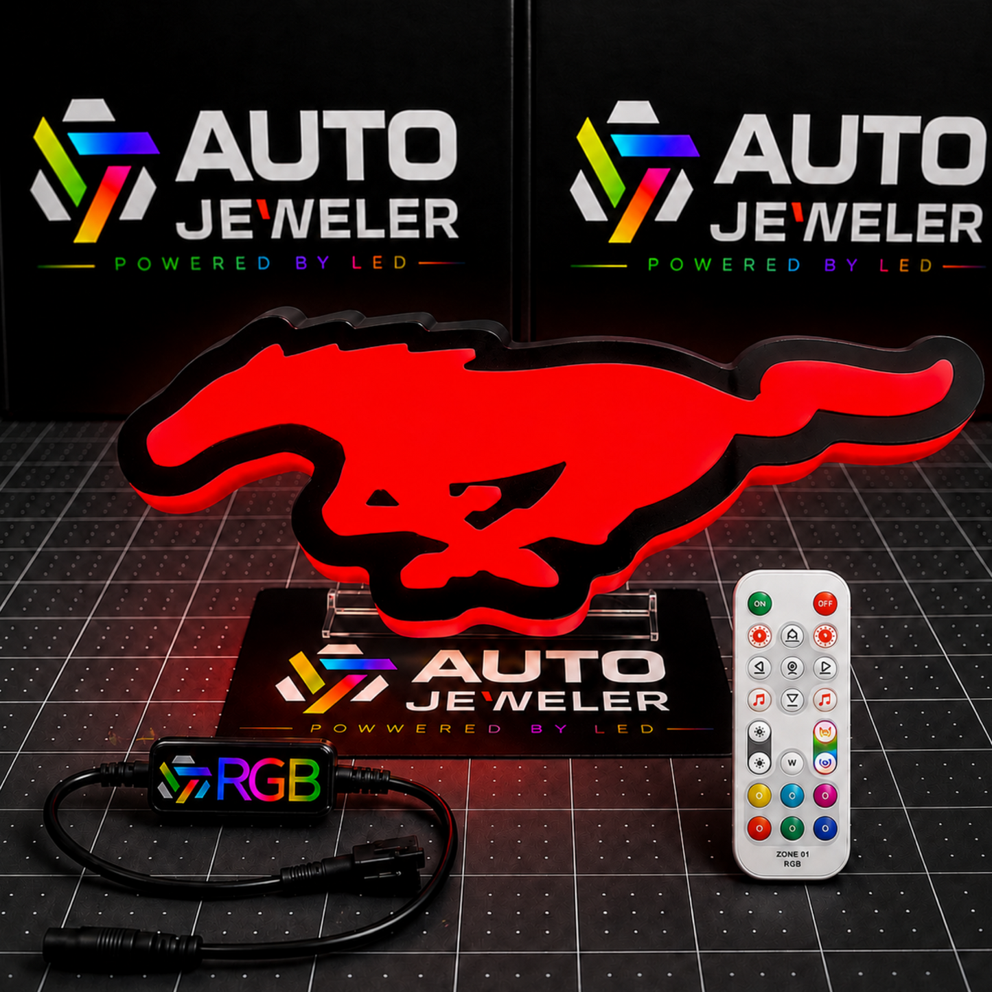  Ford Mustang Pony RGB LED grille emblem illuminated red with RGB controller, wiring harness, and handheld remote.