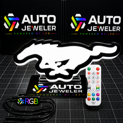  Ford Mustang Pony RGB LED grille emblem illuminated white with RGB controller, wiring harness, and handheld remote.