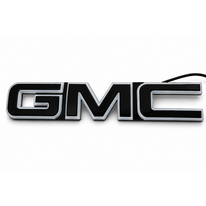 AutoJeweler 2019-2026 GMC LED illuminated Grille Emblem on a plain white background.