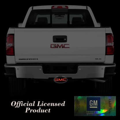 GMC truck with installed red LED hitch cover illuminated on rear receiver showing brake light function official licensed product
