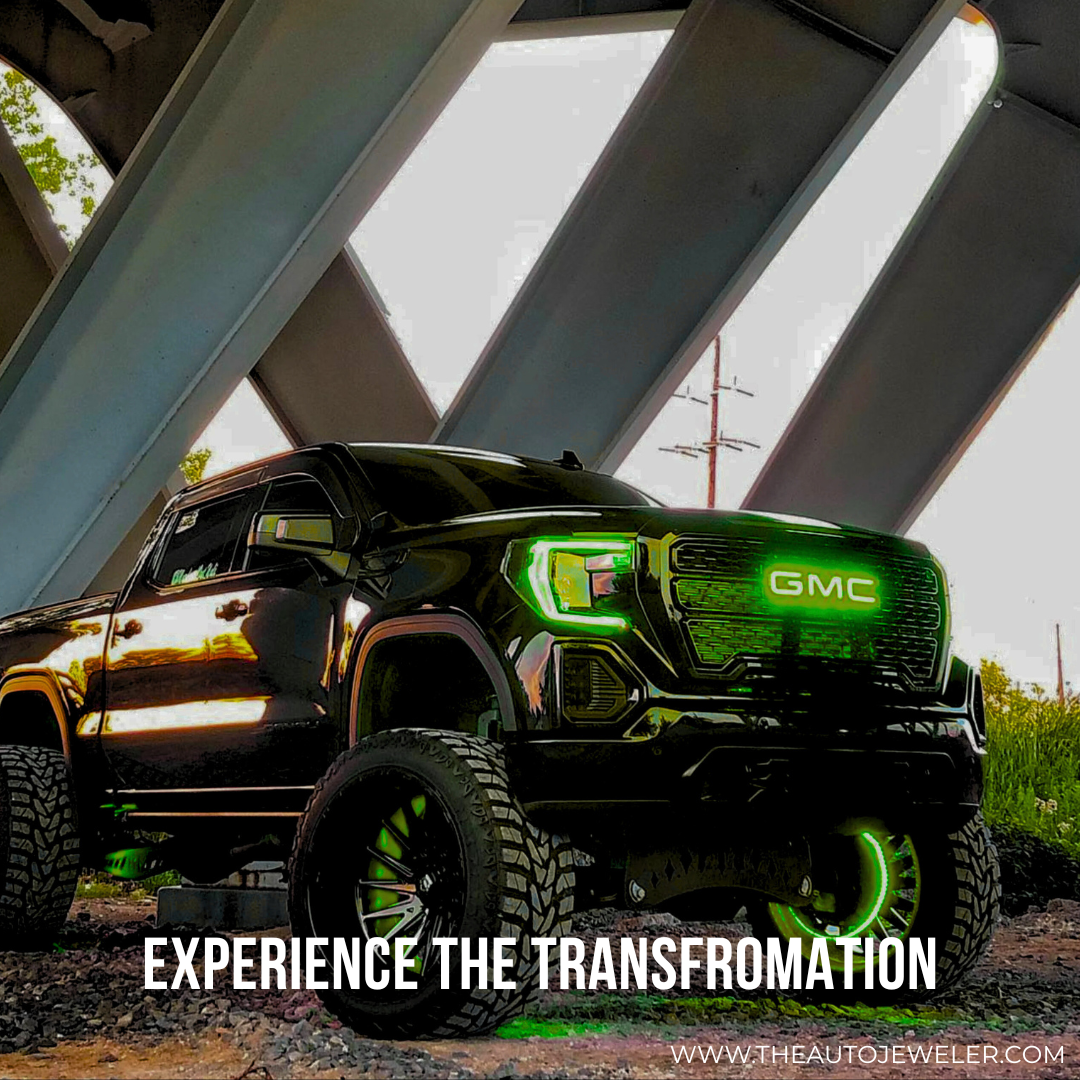 GMC truck with green RGBW LED illuminated grille emblem by AutoJeweler