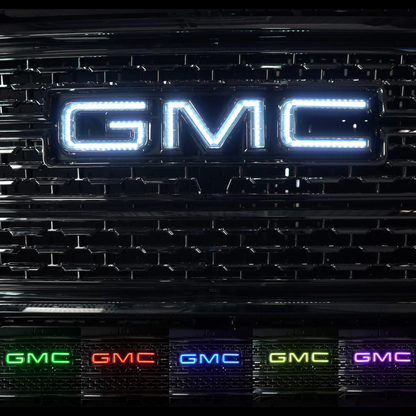AutoJeweler RGBW GMC LED illuminated grille logo showing bright white output and multiple color options for GMC Sierra trucks.