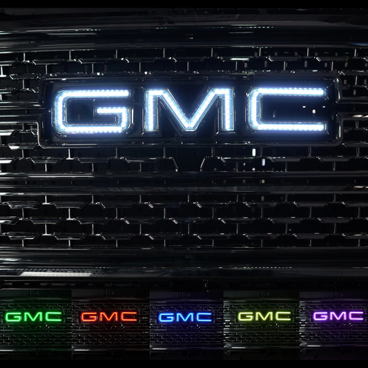 AutoJeweler RGBW GMC LED illuminated grille logo showing bright white output and multiple color options for GMC Sierra trucks.