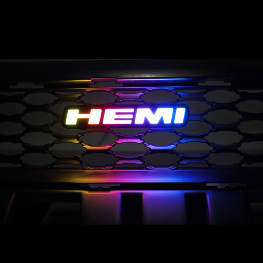 HEMI RGB Flow Series LED grille emblem with multicolor gradient lighting installed on vehicle grille