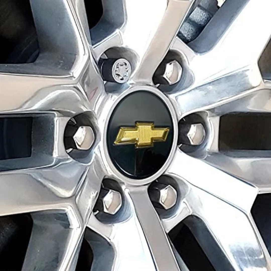 83 mm Chevy bowtie center cap installed on wheel—gloss black, snap-on fit for 2014–2021 Silverado, Suburban, Tahoe.