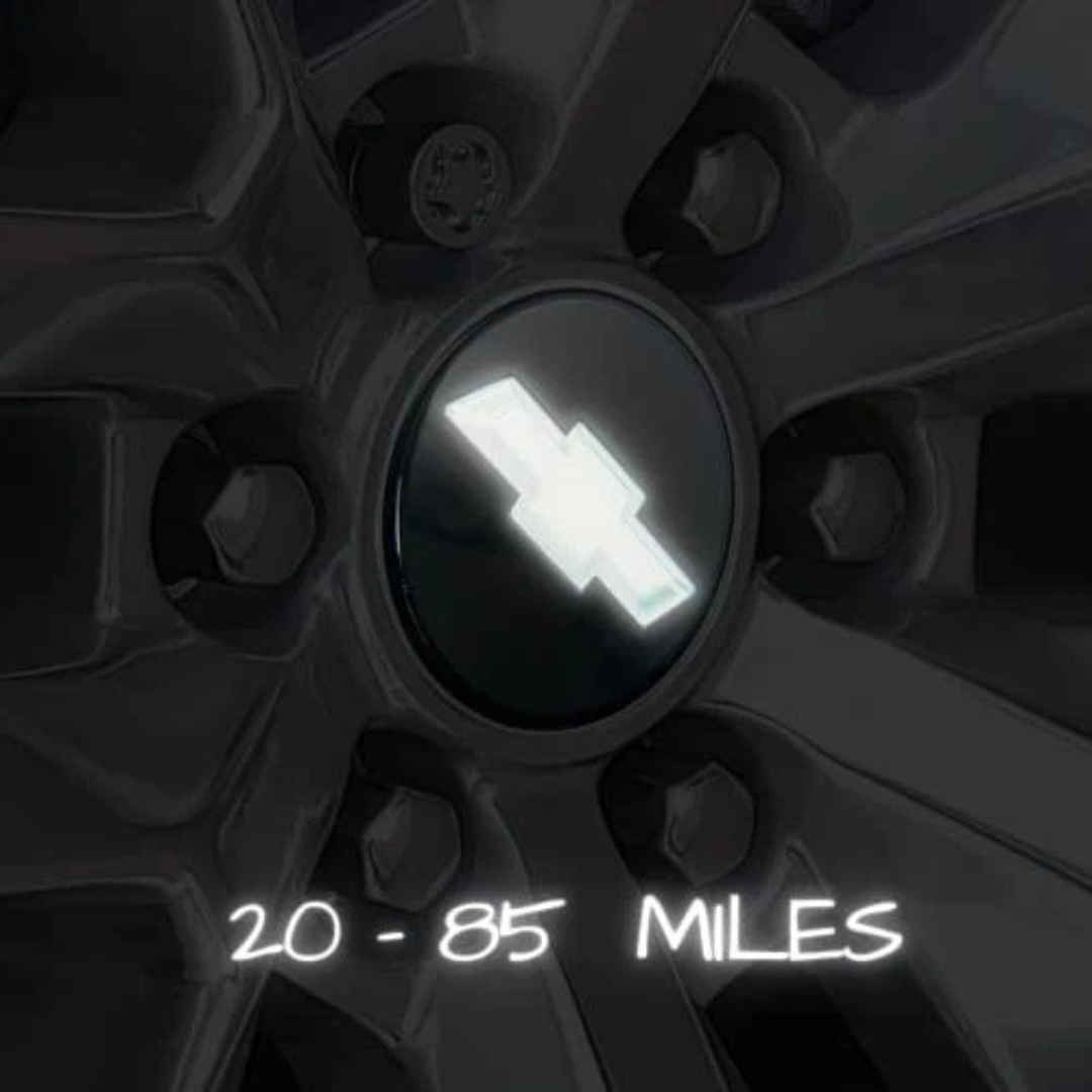 Motion-activated LED Chevy bowtie center cap glowing while driving; no wiring or external power required.