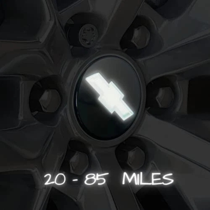 Motion-activated LED Chevy bowtie center cap glowing while driving; no wiring or external power required.