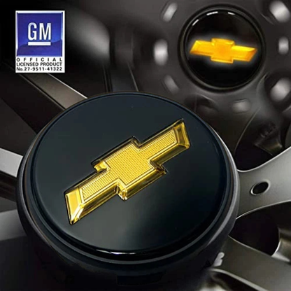 GM-licensed illuminated Chevy wheel center cap, 83 mm gold bowtie on black, installed on Silverado/Suburban/Tahoe wheel.