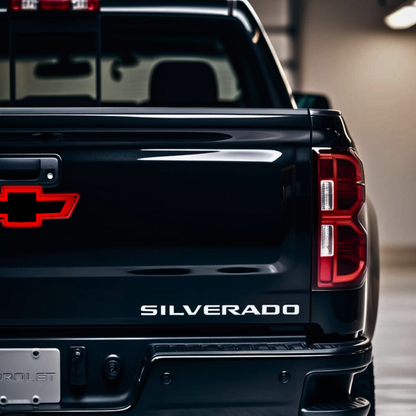 Lifestyle studio shot of Chevy Silverado tailgate with red LED bowtie installed near handle.