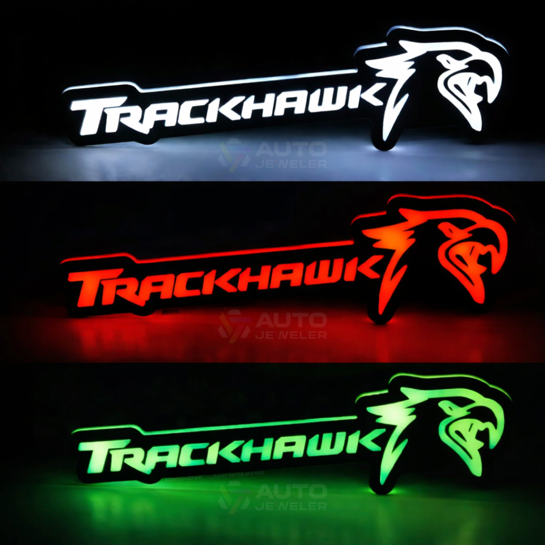 Jeep Trackhawk RGB LED grille emblem showing solid white, red, and green color options on Trackhawk badge