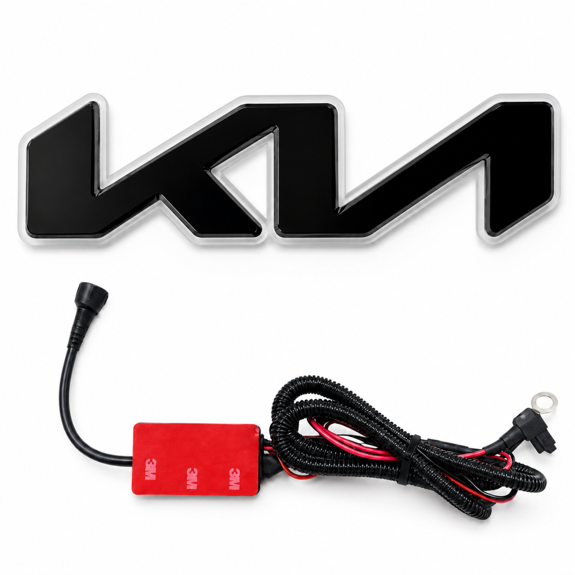 A black 3D-effect 'KIA' emblem badge shown above its wiring harness and control module on a plain white background.