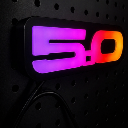 RGB Flow Series 5.0 LED grille emblem close up gradient color flow purple pink orange automotive lighting