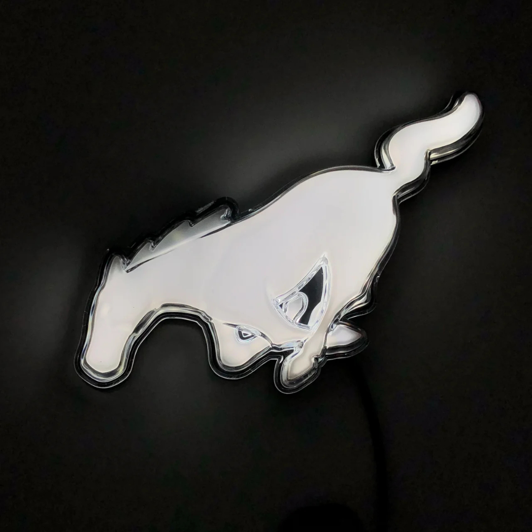 2015–2023 Ford Mustang S550 White LED illuminated pony grille emblem glowing on black background