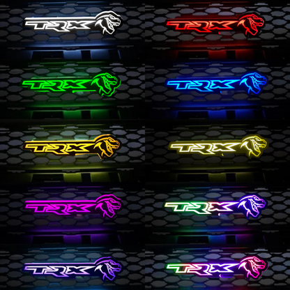 TRX LED grille emblem color options in white, red, green, blue, yellow, purple, and RGBW on a dark honeycomb background.