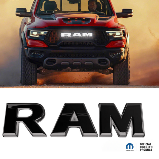 Red Ram truck driving on a dirt road with 'RGB' logo above and 'RAM' logo below.