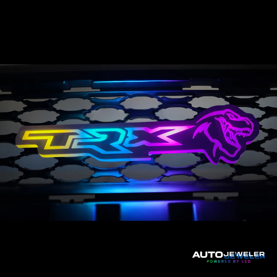 TRX logo with colorful lighting on a black background, featuring AUTOJEWELER branding.