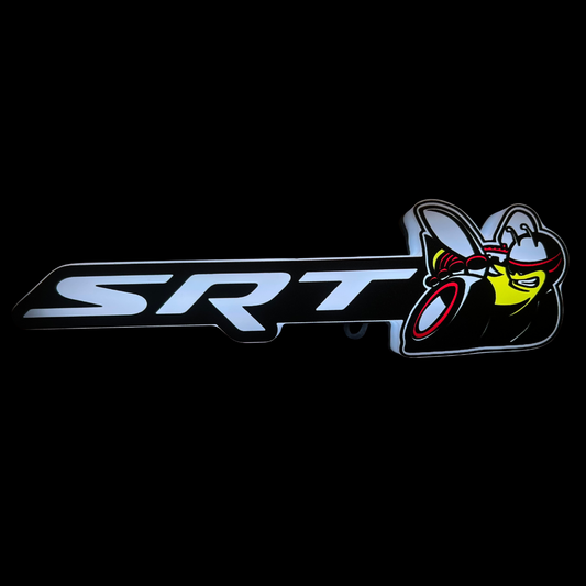 SRT Scat Bee full-color RGB Flow-Series LED emblem glowing on black grille