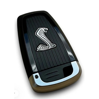 Angled view of Shelby Cobra Super Snake black replacement key fob shell with chrome trim