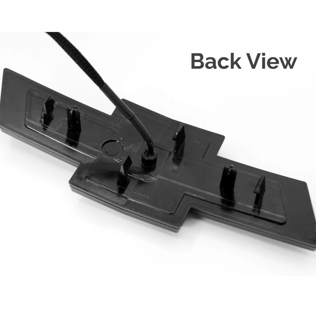 Rear mounting tabs and wiring connection on Silverado LED grille bowtie emblem