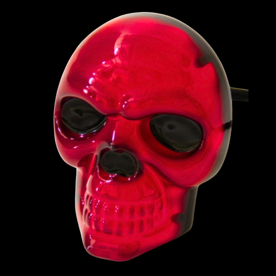 Red illuminated skull LED trailer hitch cover angled view brake light glowing automotive hitch accessory
